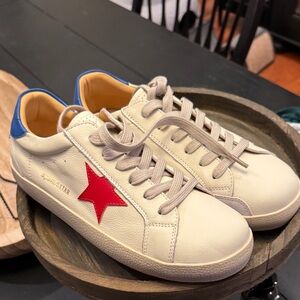 White Sneakers with Red Star Accent